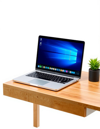 Laptop on wood table isolated on white background with clipping path.