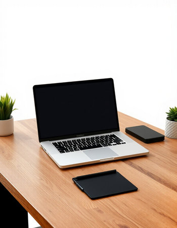 Laptop on a wooden desk with tablet on white background