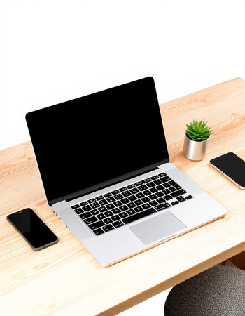 Modern workspace with blank screen laptop computer, smartphone and coffee cup on wooden table...