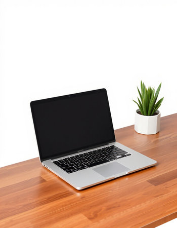 Laptop on wooden table with white wall background, work space concept