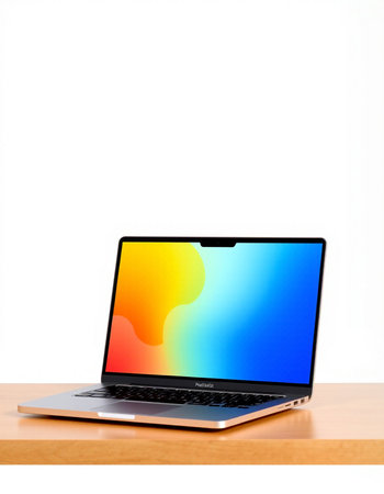 Laptop on wood table and white wall background, clipping path included