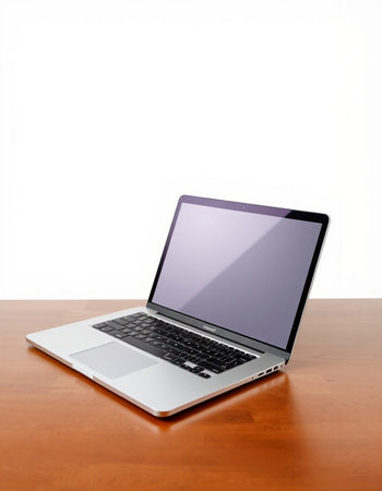 Laptop on wooden desk isolated on white background with clipping path.
