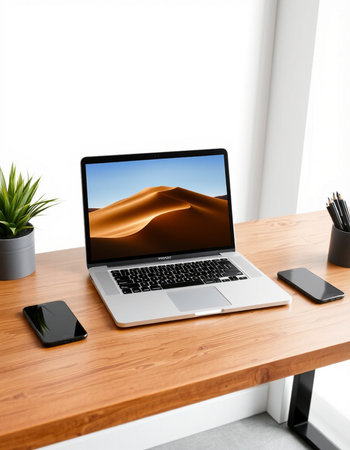 laptop with sand dune on table in office. 3d rendering.