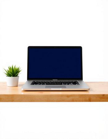 Laptop on wood shelf with white background, clipping path included.