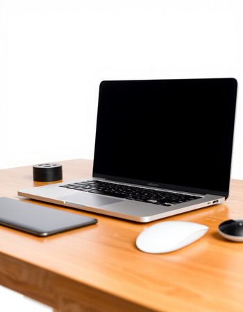 Laptop computer with blank screen on wood table isolated on white background