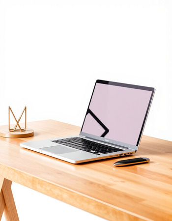 Laptop with blank screen on a wooden table isolated on white background