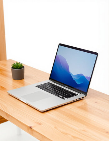 Laptop on a wooden table with white background, clipping path included
