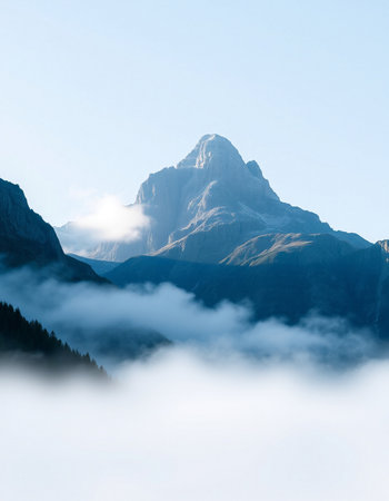 Mountain landscape with clouds and fog in the morning. Switzerland.の写真素材