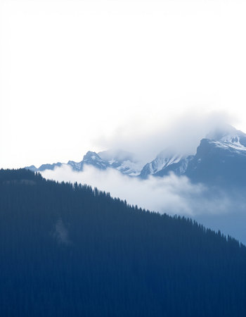 Mountains in the fog. Snow and fog in the mountains.の写真素材