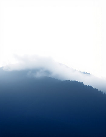 Silhouette of a mountain range in the fog. Beautiful nature landscape.の写真素材