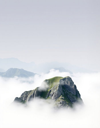 Mountain landscape with clouds and fog on the top of the mountainの写真素材