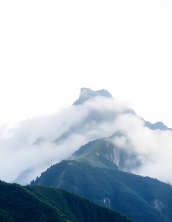 Mountains in the clouds on a foggy dayの写真素材