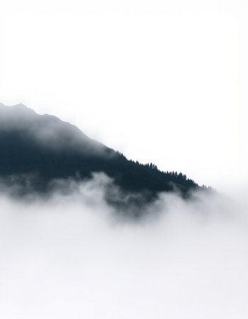 Mountain landscape with clouds and fog in the italian alpsの写真素材