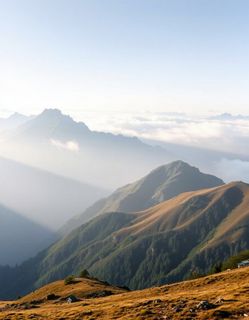 Mountain landscape with fog and clouds at sunrise. Caucasus Mountains, Georgia.