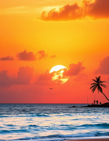 Beautiful sunset on the beach with palm trees and sea waves.