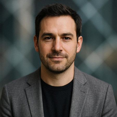 Portrait of a handsome man in a business suit looking at the camera