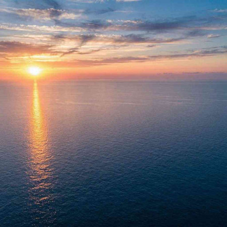 Aerial view of sunset over the sea. Beautiful sunset above the sea.