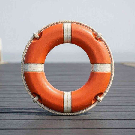 Lifebuoy on a wooden pier in the port of Barcelona.