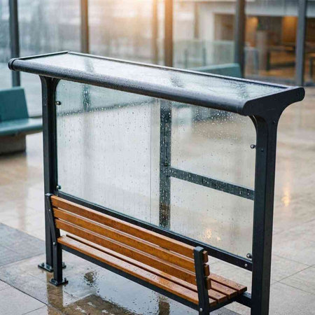 Empty bench with raindrops in the corridor of a modern building.
