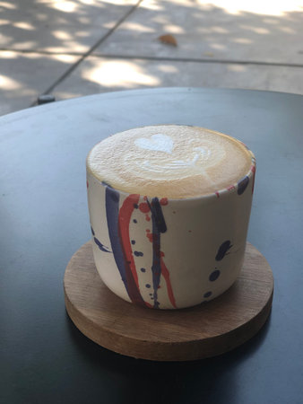 Coffee latte art on the table in coffee shop.の写真素材