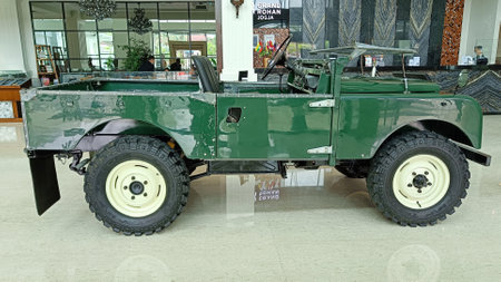 Yogyakarta, Indonesia - February 2023 : Army Green Vintage Land Rover Car Parked in Hotel Lobbyのeditorial素材