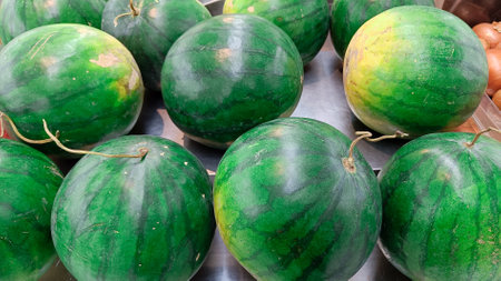 high angle view of whole green watermelon in fruit marketの写真素材