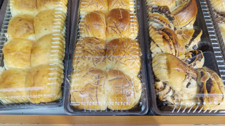 Sweet Bread with various flavors in a plastic box displayed in a cake shopの写真素材