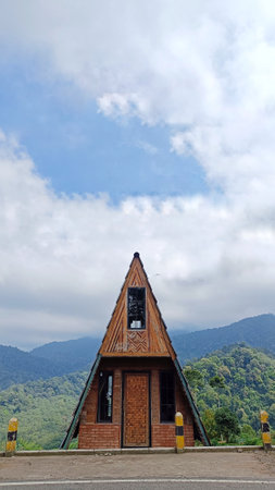 Triangular wooden house in the middle of a vegetable plantation for copy space of storyの写真素材