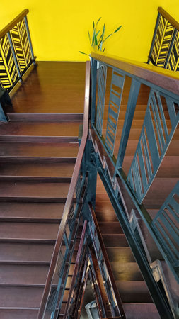 A wooden staircase forming a triangular perspectiveの写真素材
