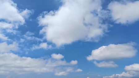 Sunny Blue Sky with clouds background with Copy Space For Textの写真素材