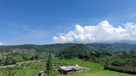 village scape with mountains and blue sky in the backgroundの写真素材