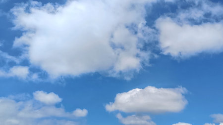 Sunny Blue Sky with clouds background with Copy Space For Textの写真素材