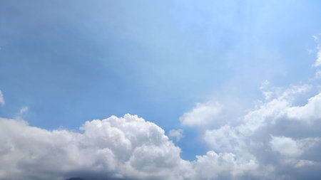 Bright Blue Sky with clouds background, Copy Space For Textの写真素材