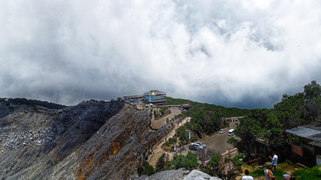 view of building on top of limestone craters hills with blue sky backgroundの写真素材