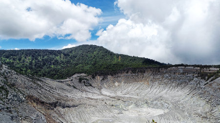 landscape of  limestone craters mountains and hills with blue sky backgroundの写真素材
