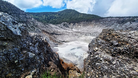 landscape of  limestone craters mountains and hills with blue sky backgroundの写真素材