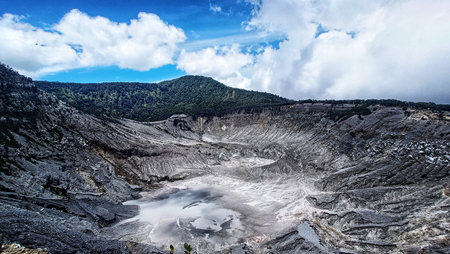 landscape of  limestone craters mountains and hills with blue sky backgroundの写真素材