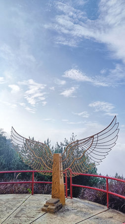 Wing statue for tourism photo spot with blue sky and white clouds backgroundの写真素材