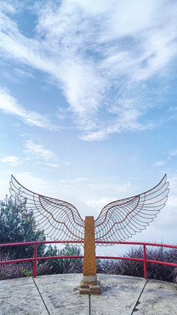 Wing statue for tourism photo spot with blue sky and white clouds backgroundの写真素材