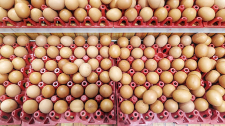 High Angle View of chicken eggs in crates that are sell in the market
