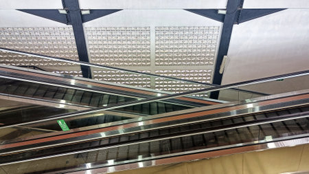 View of Symmetrical Escalator with two way up and down in modern multi-storey building