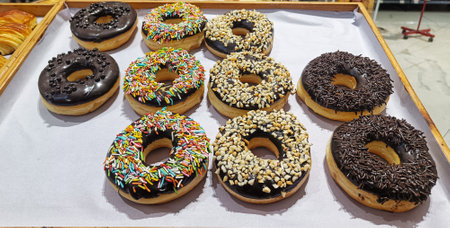 Sweet and delicious donut cake with variety of toppingの写真素材
