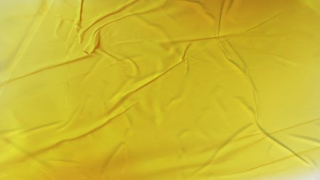 orange yellow gradient Blank crumpled and creased paper poster texture backgroundの写真素材