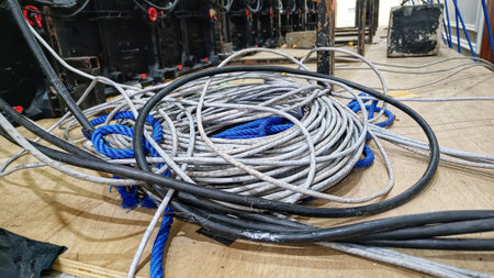abstract rolls of electrical cables and internet cables above the floor