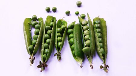 image of half pealed green pea isolated on white background