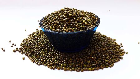 image of green lentil in bowl isolated on white background