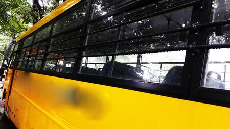yellow bus side view closeup image