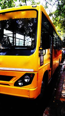 yellow bus front side view closeup image