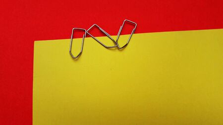 paper clip on color background with text spaceの写真素材
