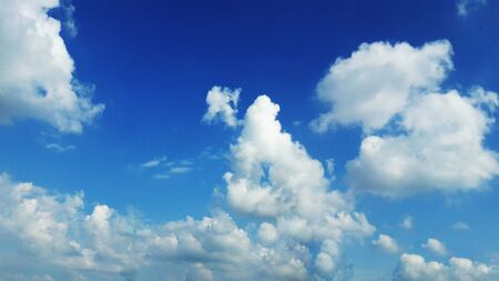 white fluffy clouds in blue sky in monsoon